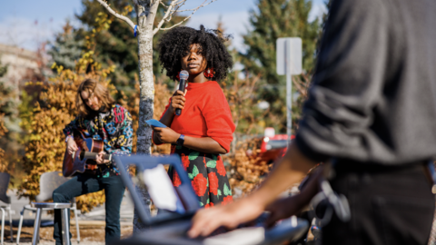 A person singing outdoors