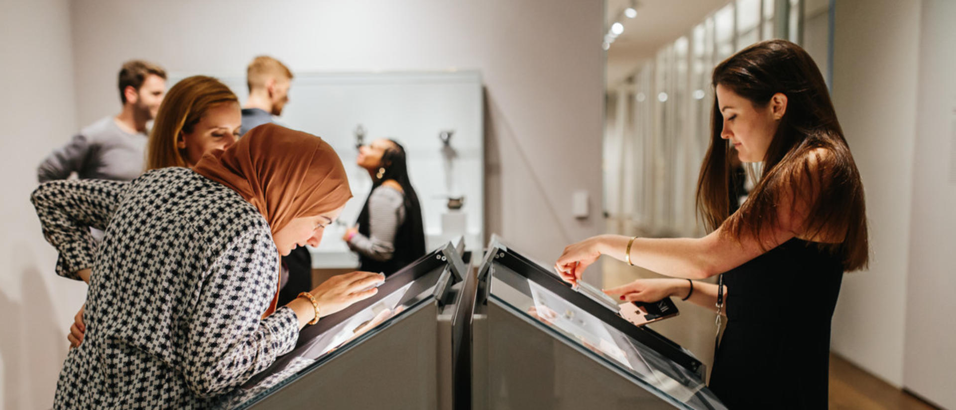 Women looking at an arts exhibit
