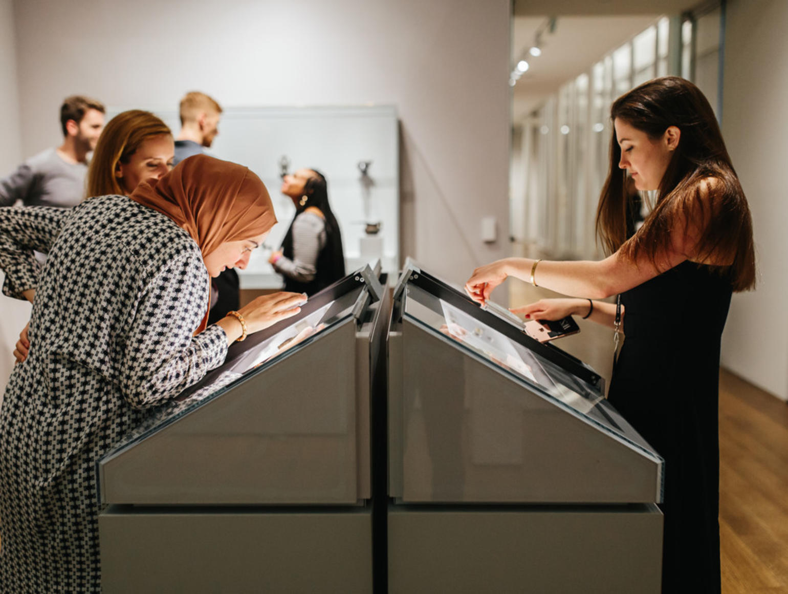Women looking at an arts exhibit